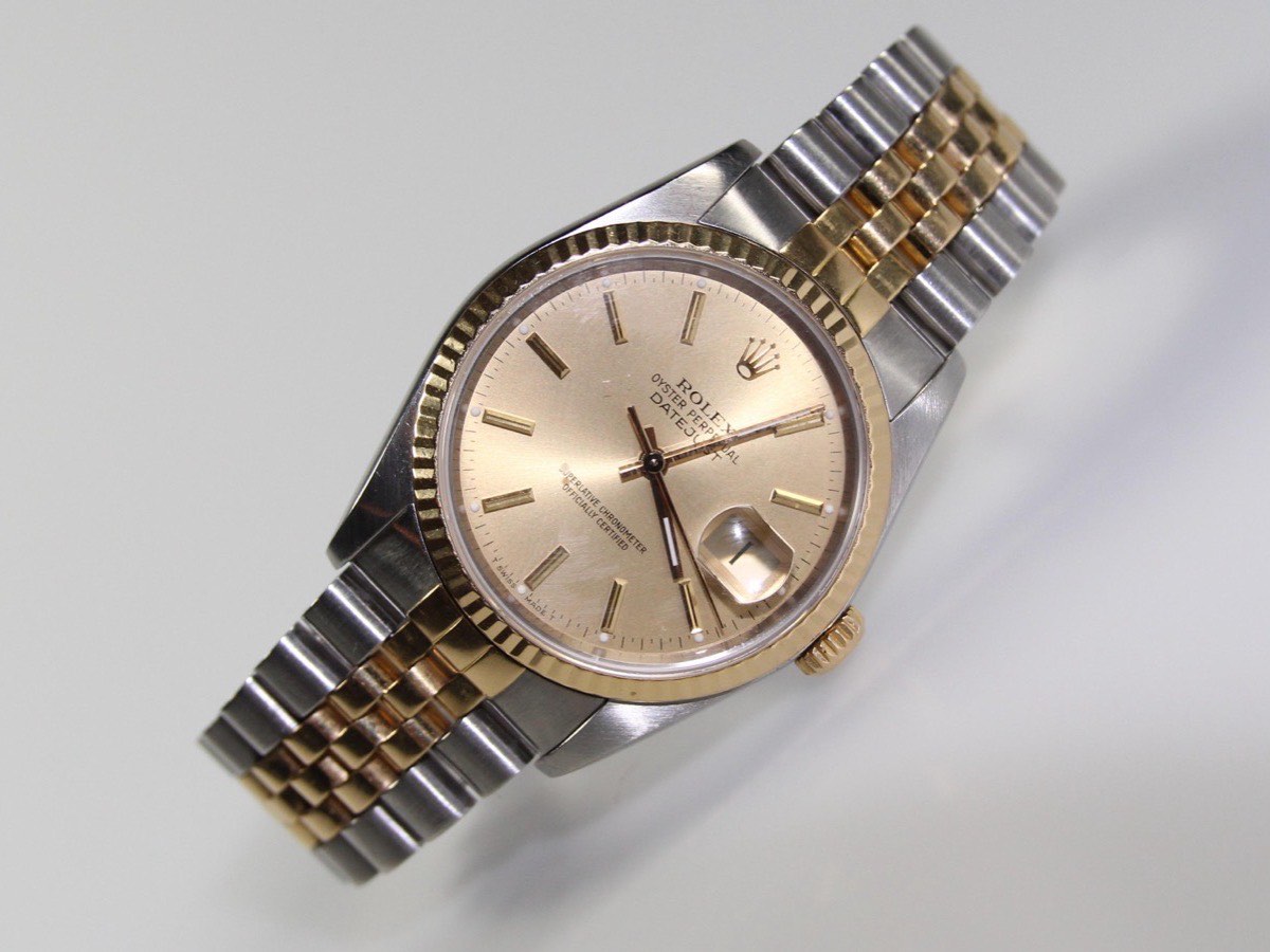Two-tone Rolex Datejust 16013 with champagne dial, gold fluted bezel, and Jubilee bracelet