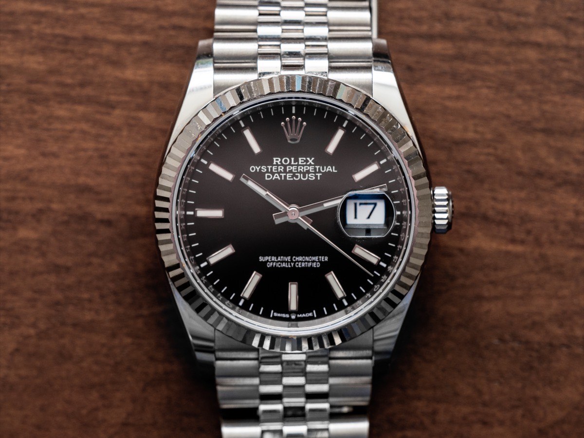 All-steel Rolex Datejust with black dial and full silver Jubilee bracelet, face-on