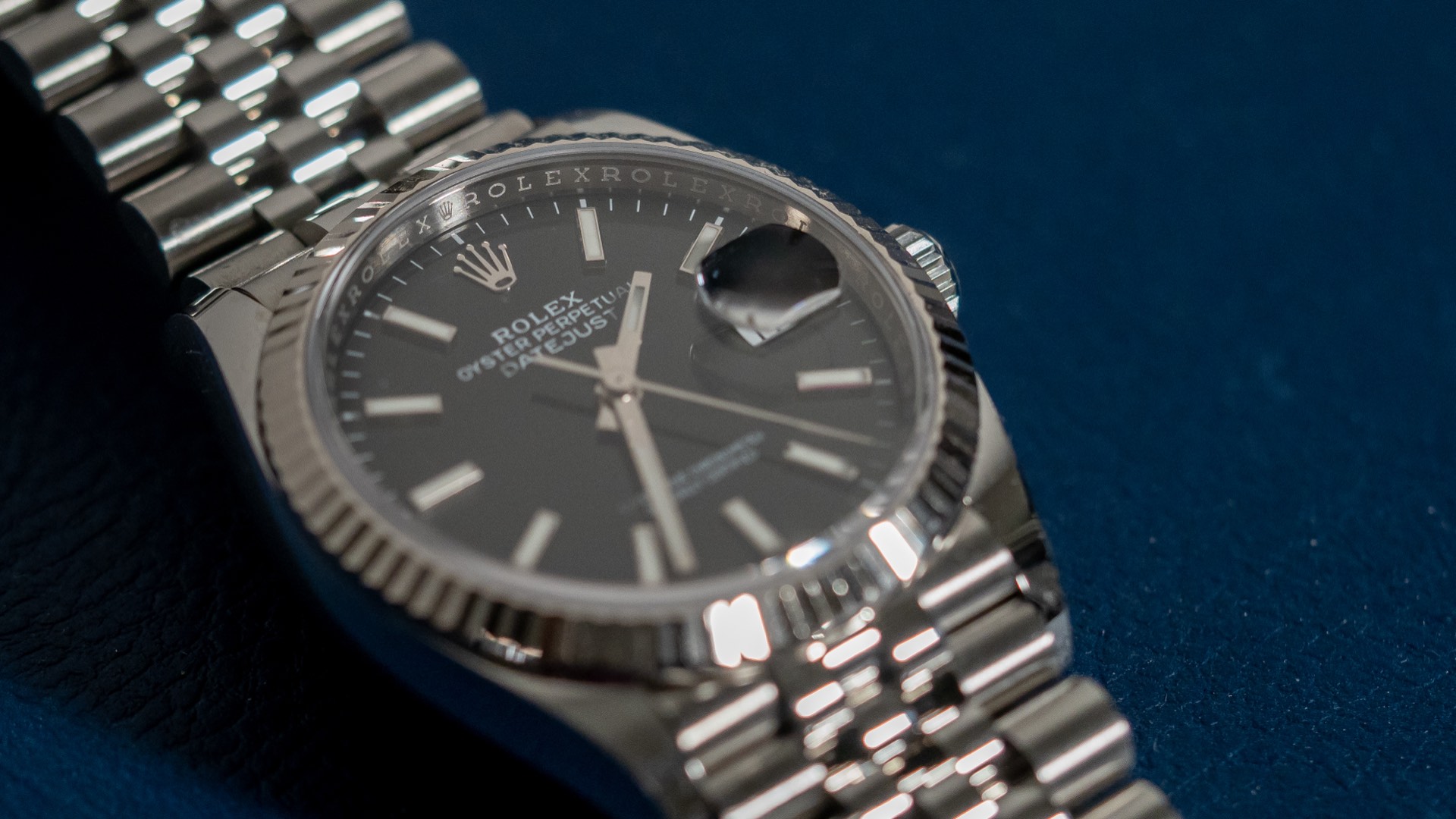 Steel Rolex Datejust 36 with black dial and Jubilee bracelet, angled diagonal view